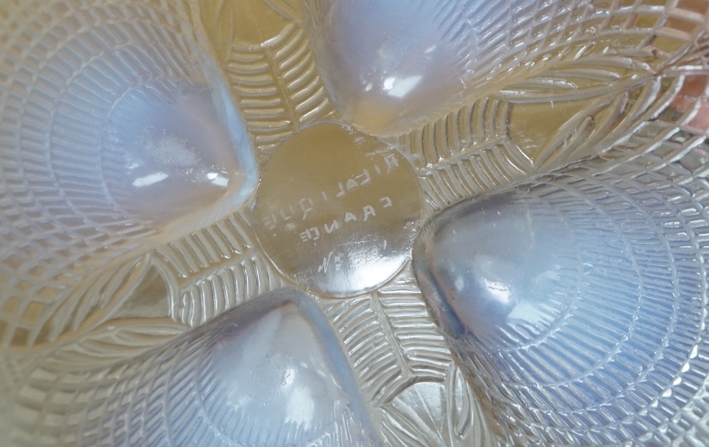 An R. Lalique coquille pattern glass bowl, no.3201, 21cm diameter. Condition - wear to base as expected, otherwise good